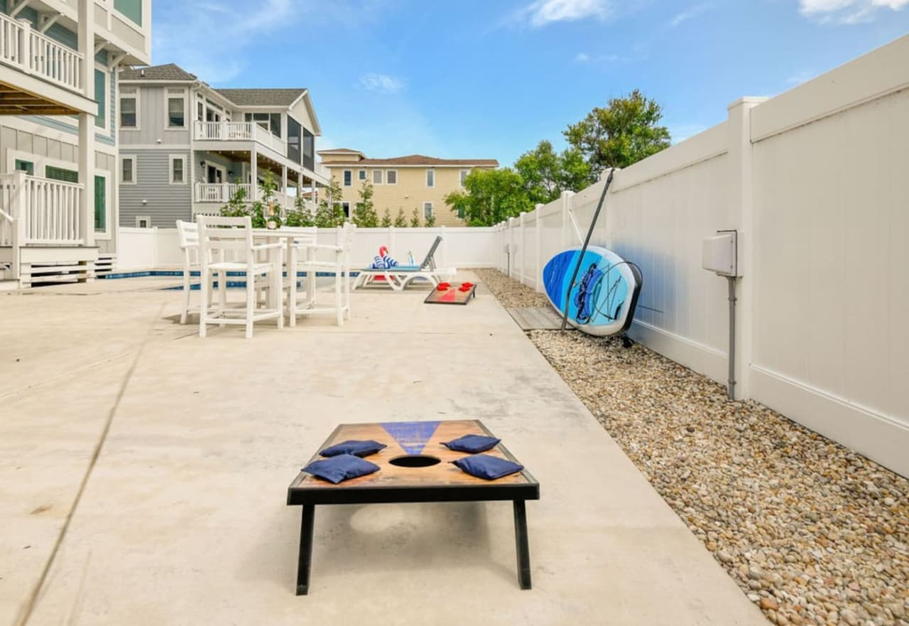 Poolside deck w/ chairs & open space to stretch out and soak up the sun.