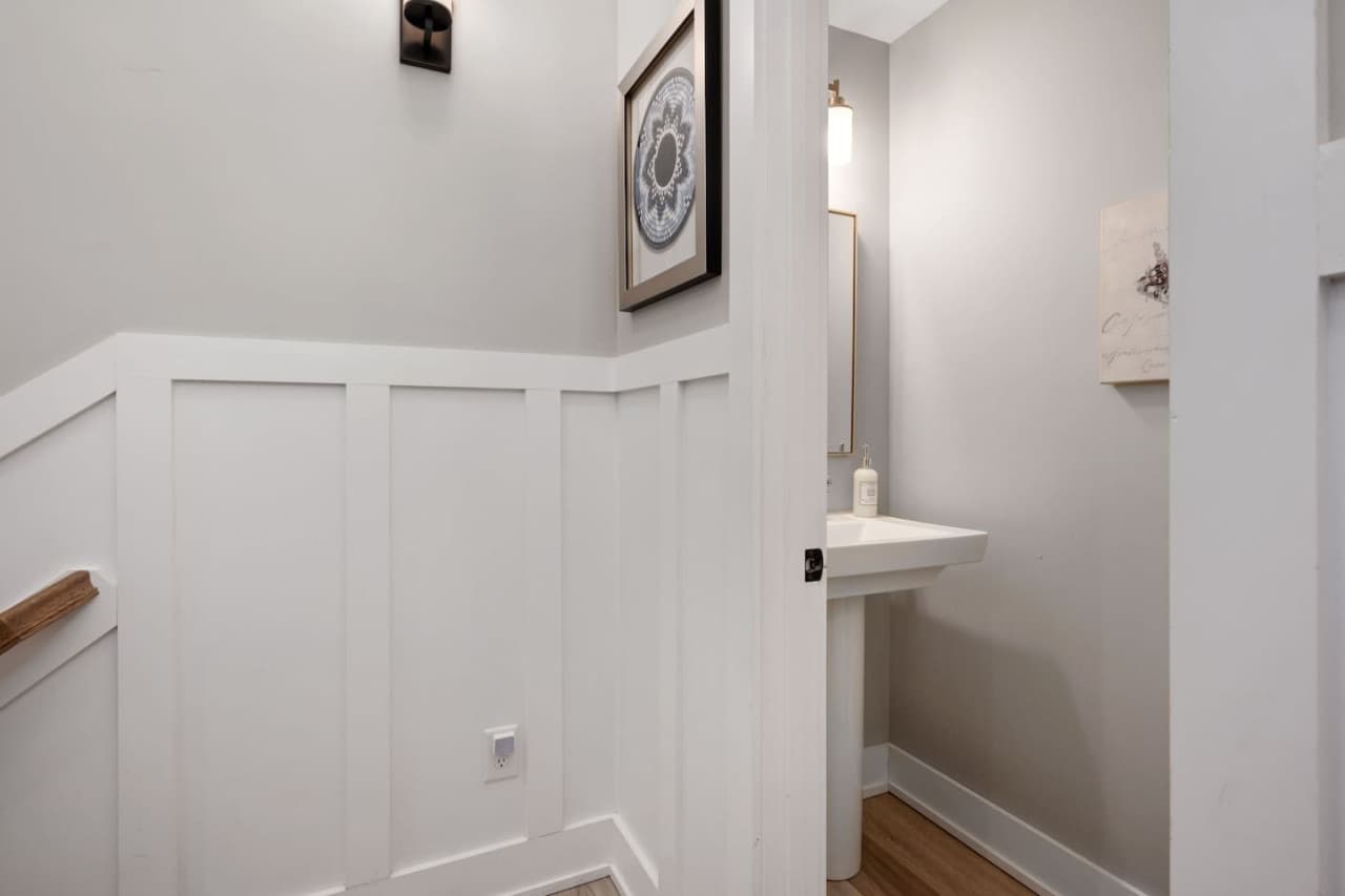 Convenient hallway half bath, thoughtfully placed for easy access.