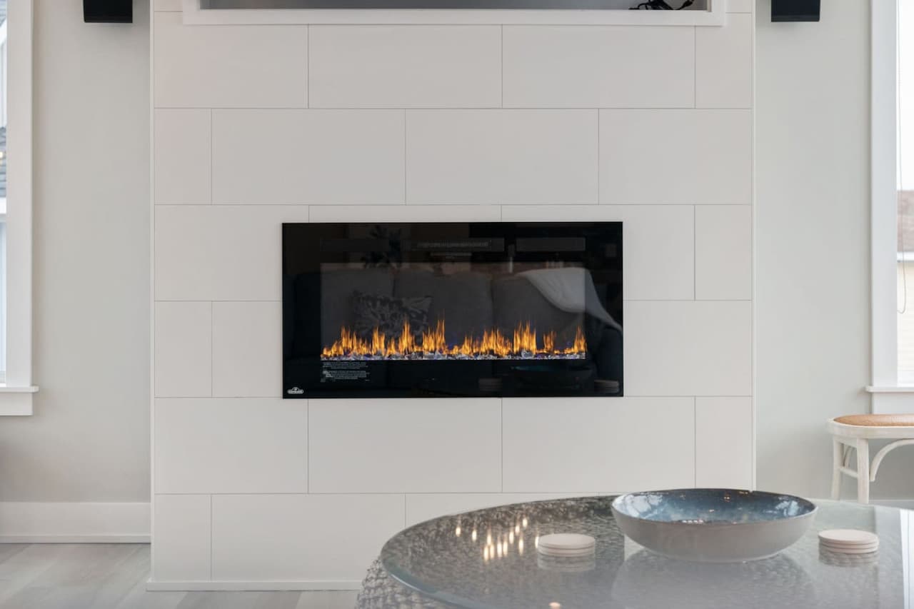Sleek built-in fireplace adding warmth & ambiance to the modern living space.