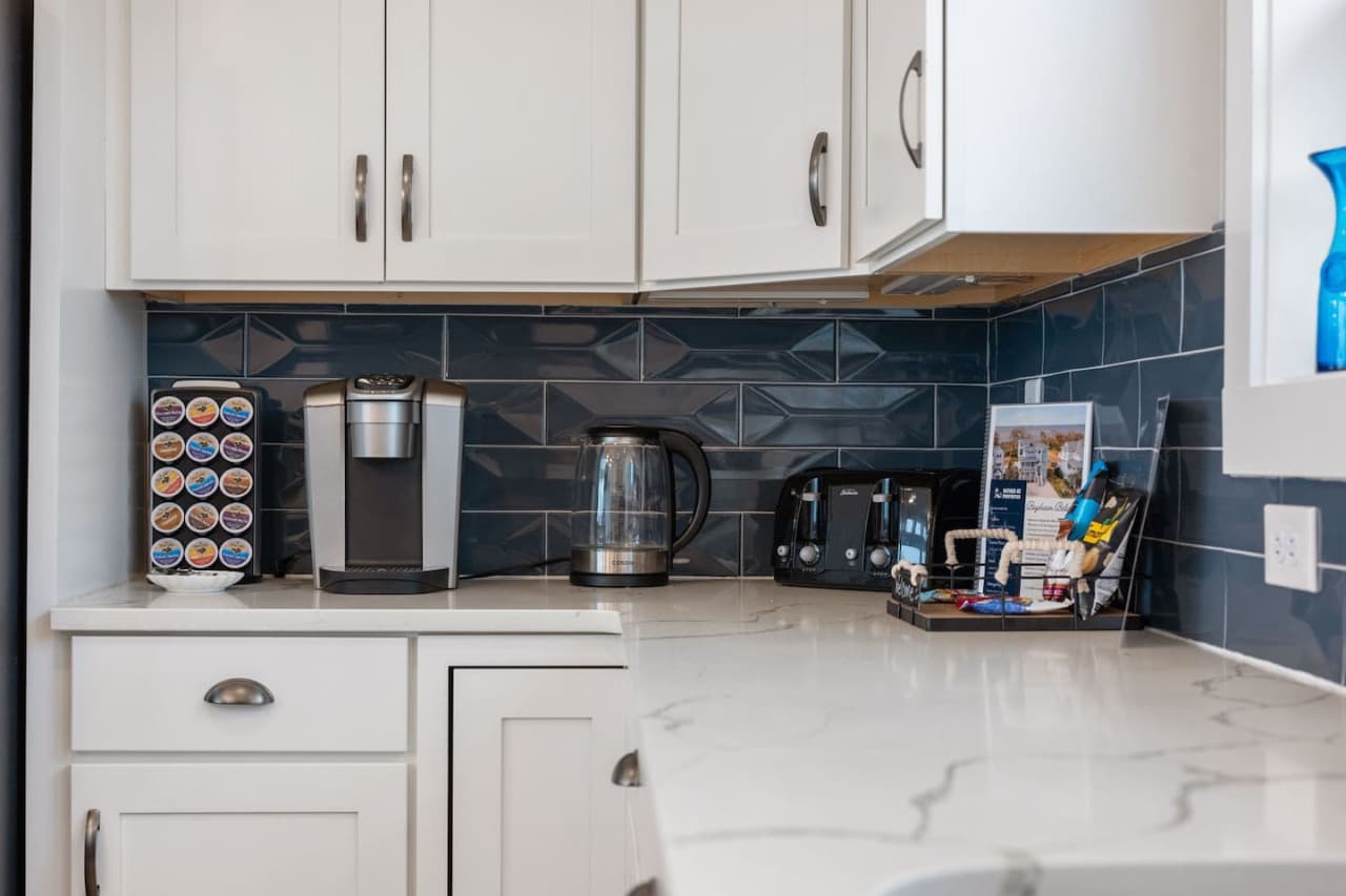 Coffee station tucked into the kitchen, stocked & ready for easy mornings at home.