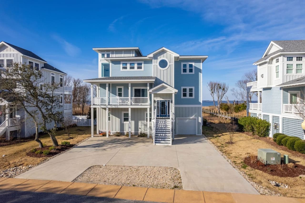 Classic coastal exterior showcasing the home’s welcoming curb appeal.
