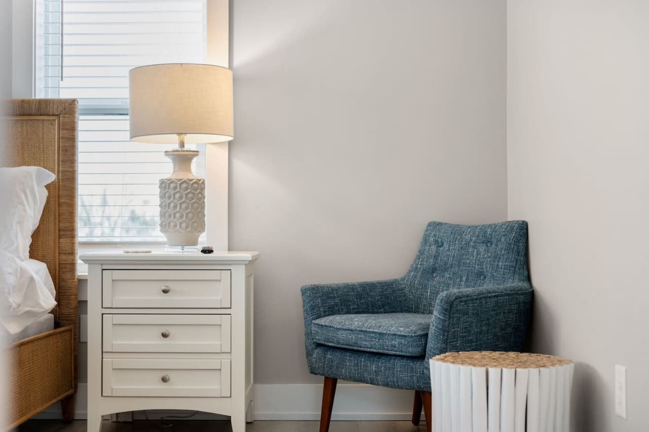 Cozy reading chair & side table, perfect for quiet moments indoors.
