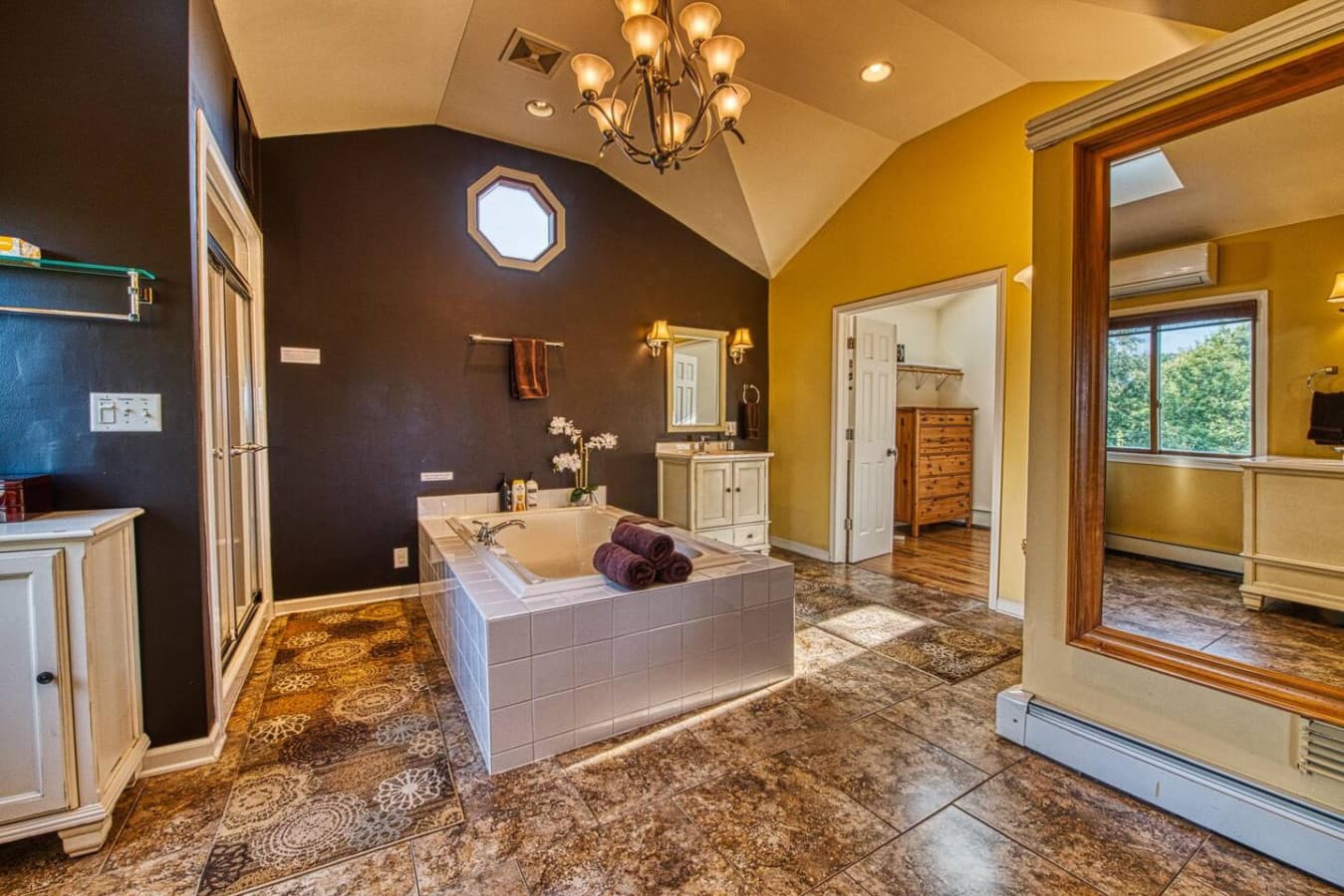 Master Suite Spa Sanctuary features a dry-cedar sauna, steam shower, rainfall shower head, large jetted tub, double vanities, private toilet room, and large walk-in closet