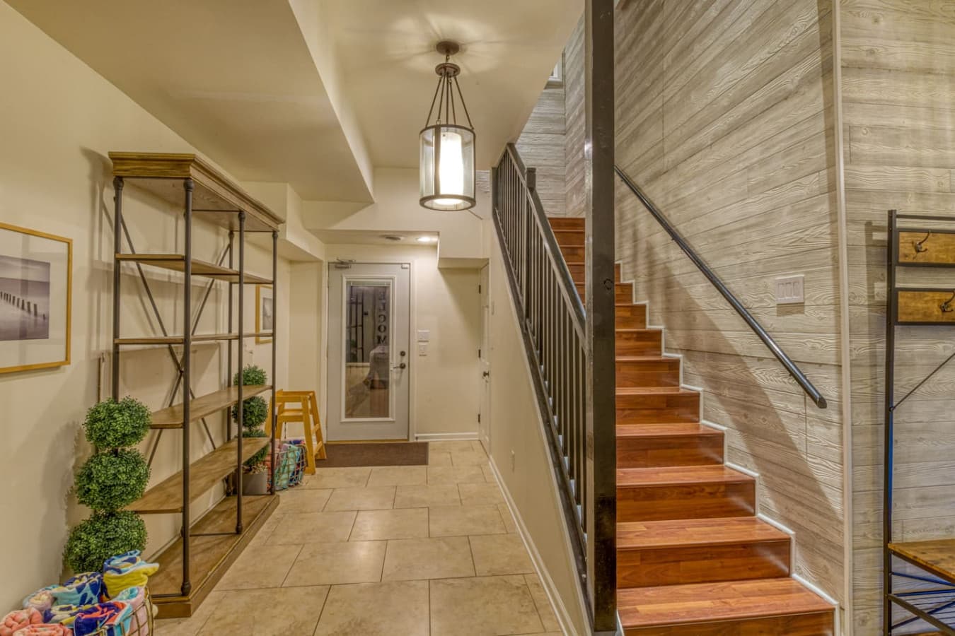 Foyer entrance with stairs leading to the Second Floor Media Room, bedrooms, another full bathroom, Master Suite, and Level 3