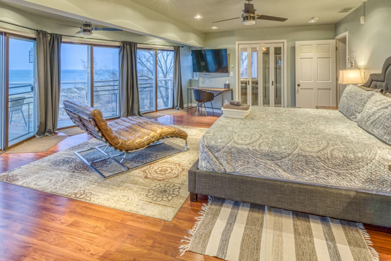 The Second Floor Master Suite also offers a dedicated workspace with desk and chair