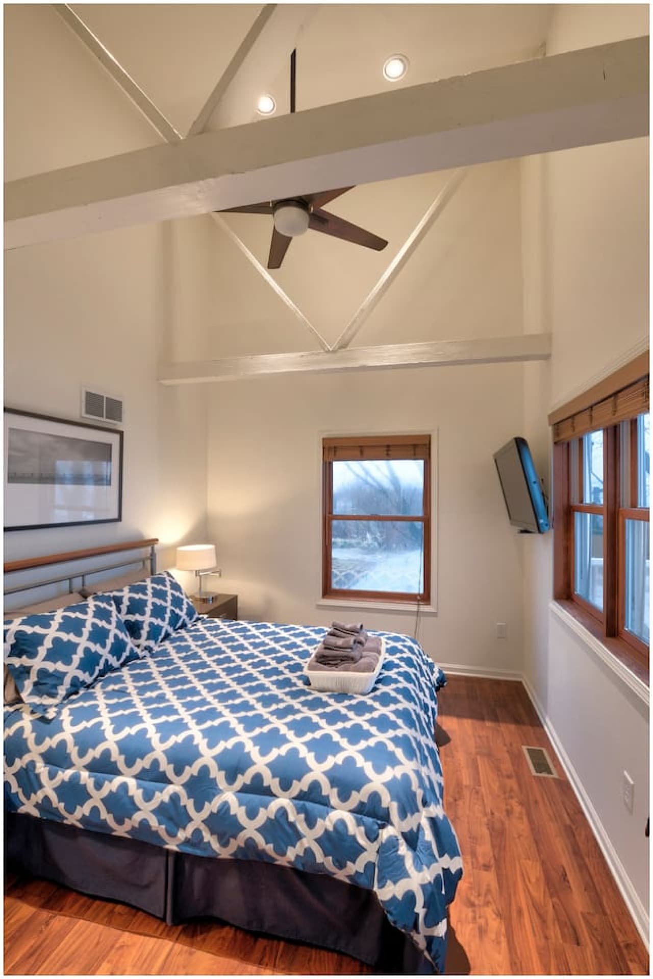 The Skyline Bedroom features 16ft beamed ceilings, a private deck, and a Smart TV.