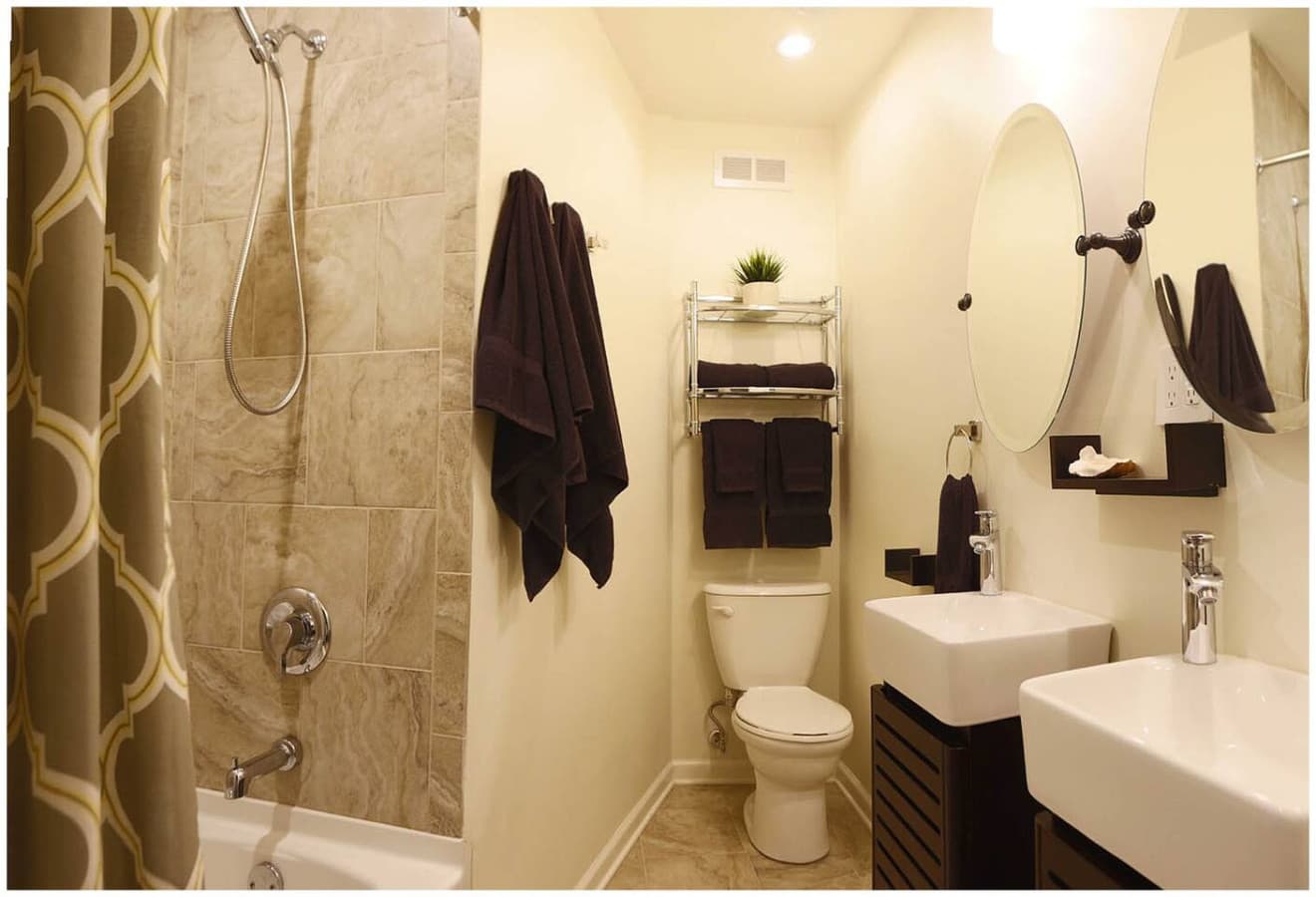 2nd Floor Bath dual floating vanities, stone tile floor and tub surround