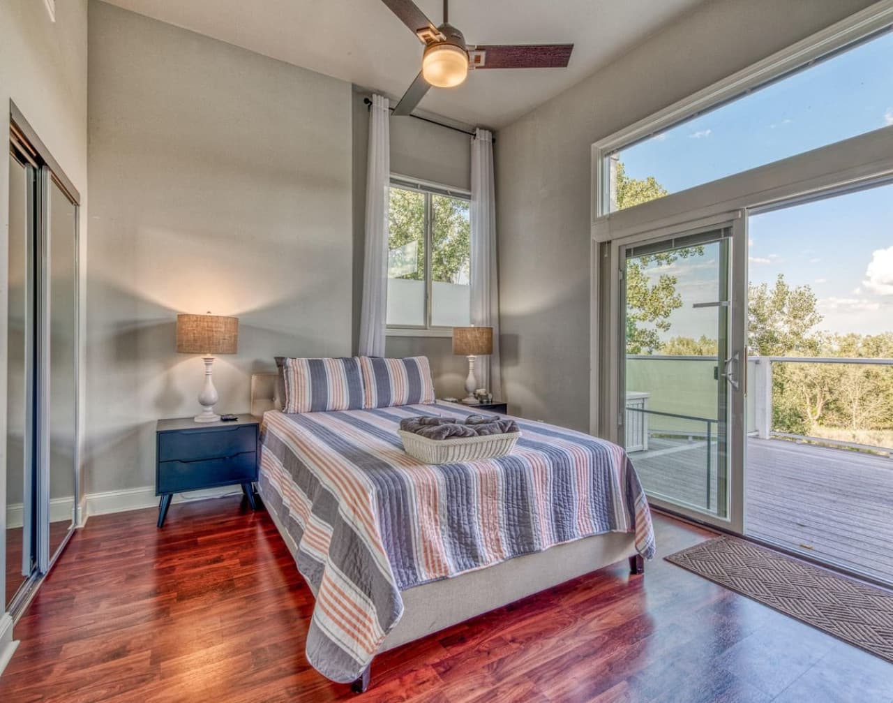 Second floor Queen Bedroom features sliding door access to the East Overlook Deck