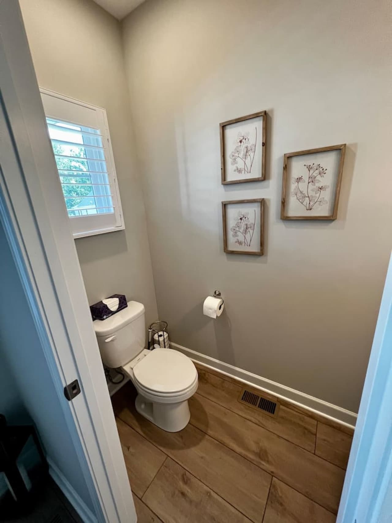 Half bath conveniently accessible from the living room/kitchen area.