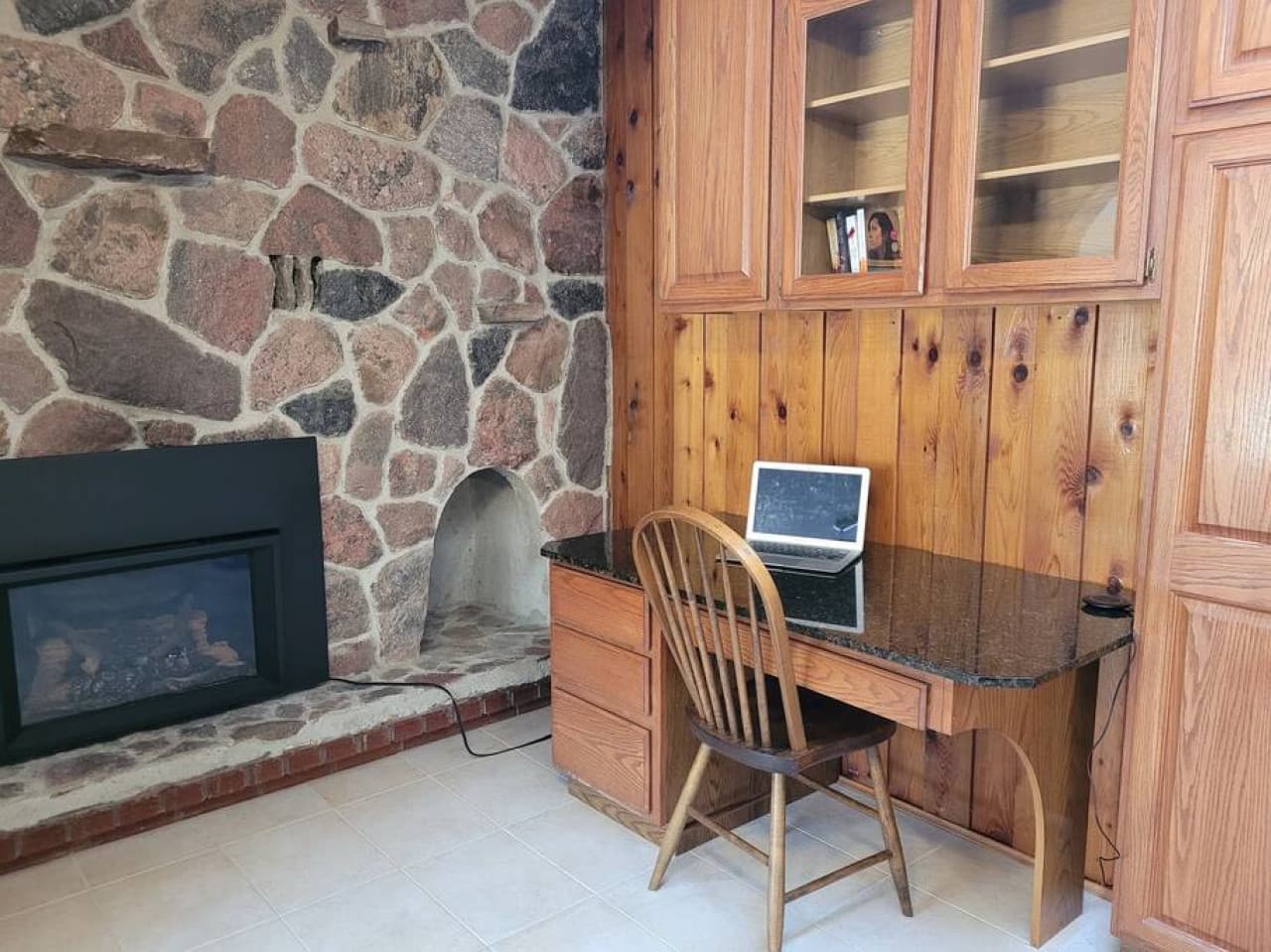 Dedicated workspace with a propane fireplace on the main floor