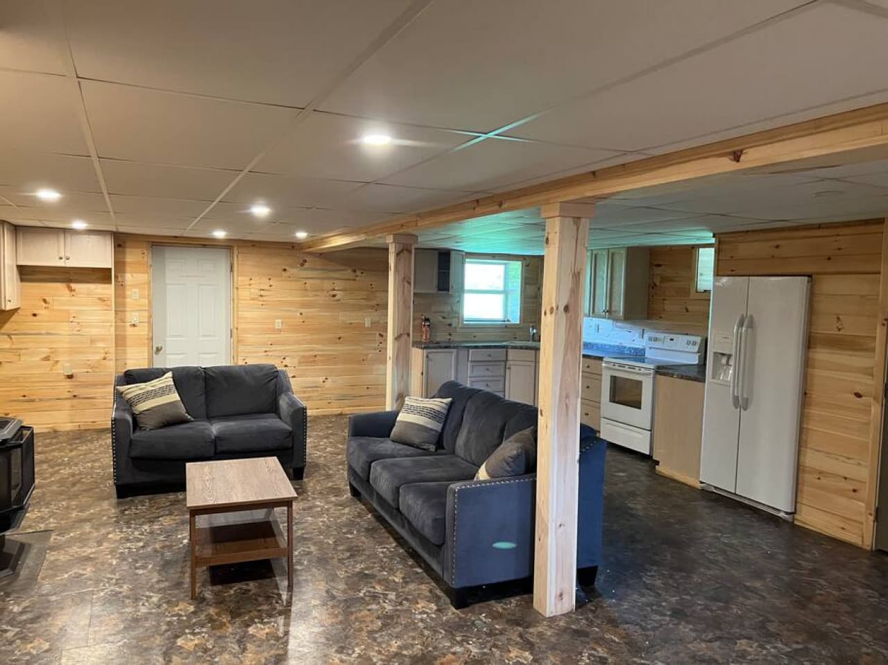 Basement entertainment area with propane fireplace and games