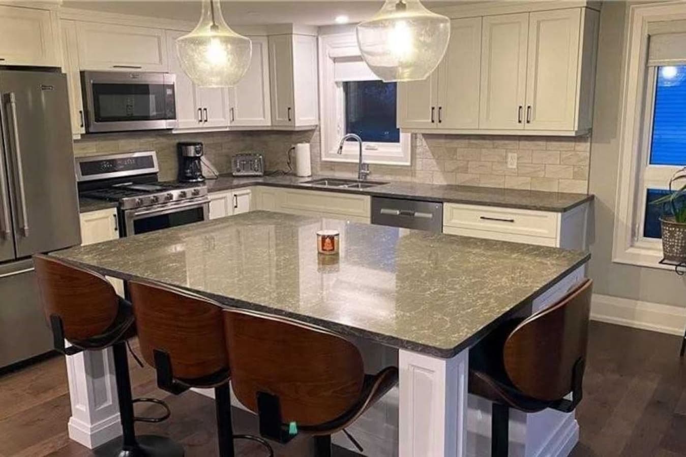Fully equipped modern kitchen with a large island for dining.