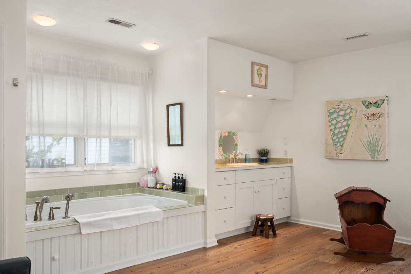 Clean bathroom w/ vanity, mirror, and a fresh, uncluttered layout for daily ease.