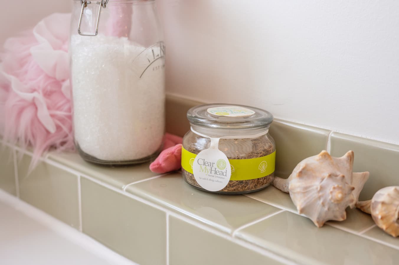 Bath detail w/ tub-side salts, candle & shells for a long soak after a day on the water.