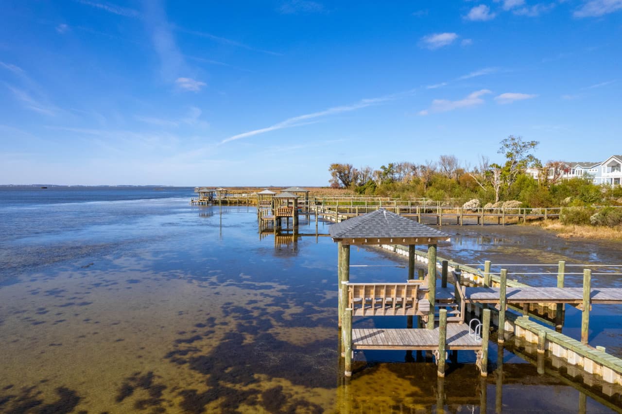 Private dock extending into calm waters, perfect for soaking in peaceful coastal surroundings.
