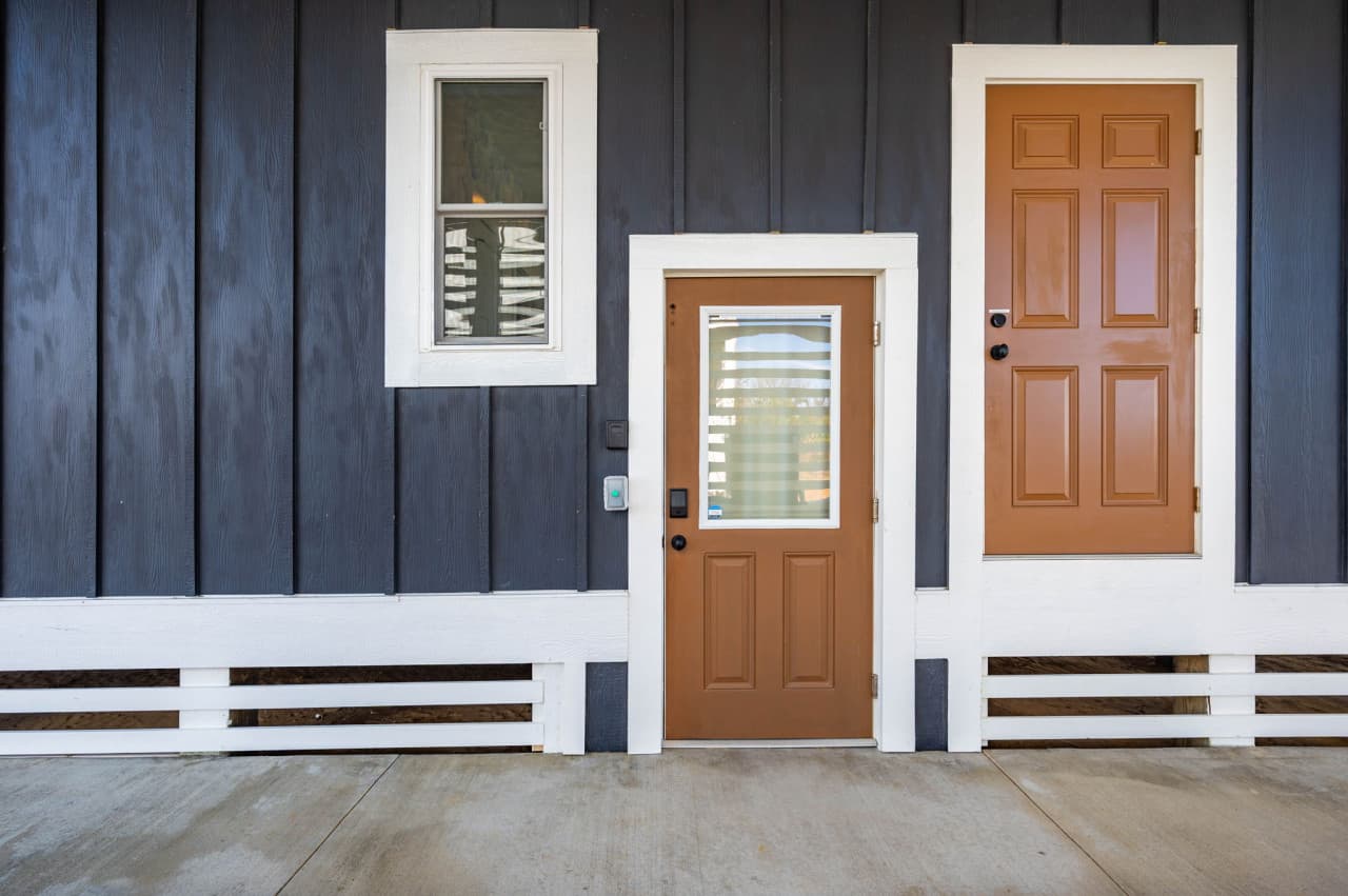 Welcoming entryway w/ bold exterior details & a clean, coastal-inspired design.