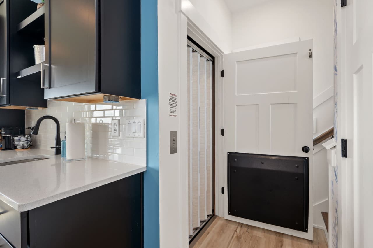 Convenient laundry nook w/ counter space & storage for longer stays.