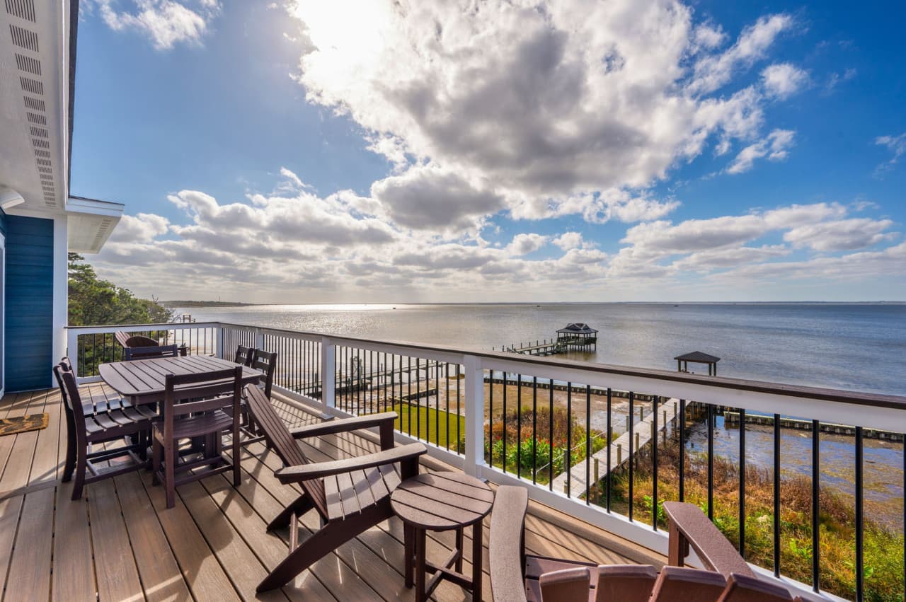 Private balcony w/ seating & wide bay views, perfect for slow mornings or sunset moments.