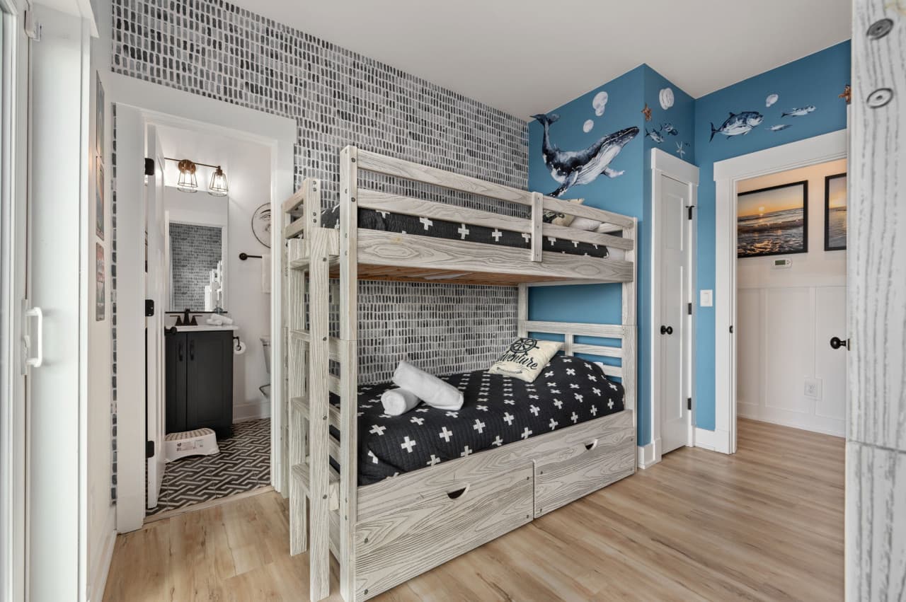 Fun bunk room w/ built-in beds, playful patterns & a layout great for group stays.