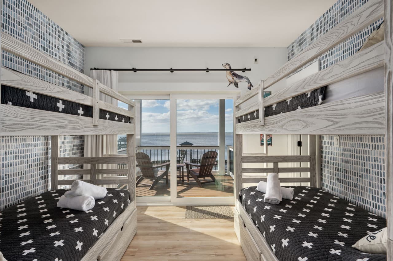 Bunk room w/ two built-in bunk sets & a slider to the deck for sound views.