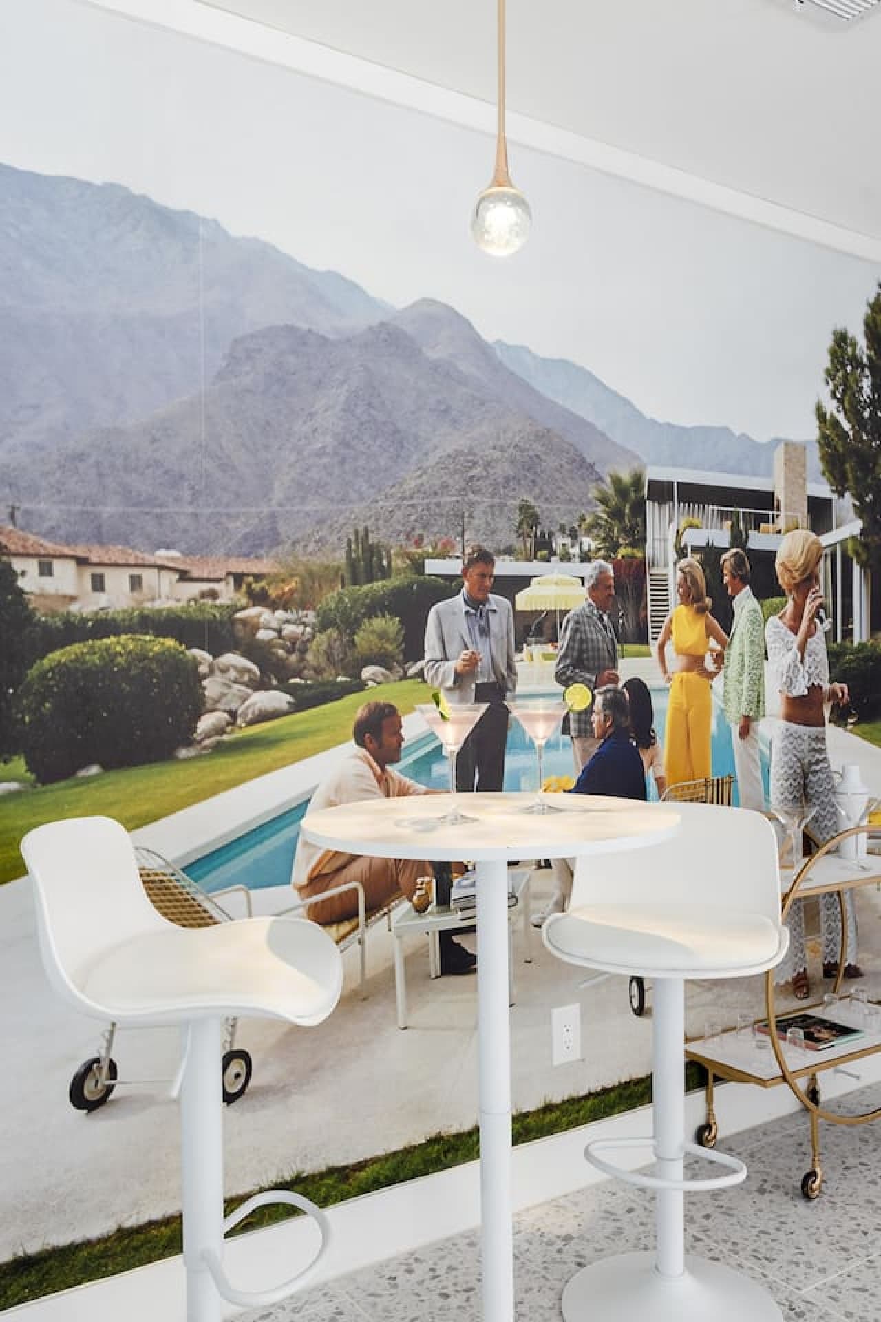 Sip on your favorite cocktail made from our convenient bar cart, set against the backdrop of our fun, Palm Springs-inspired mural