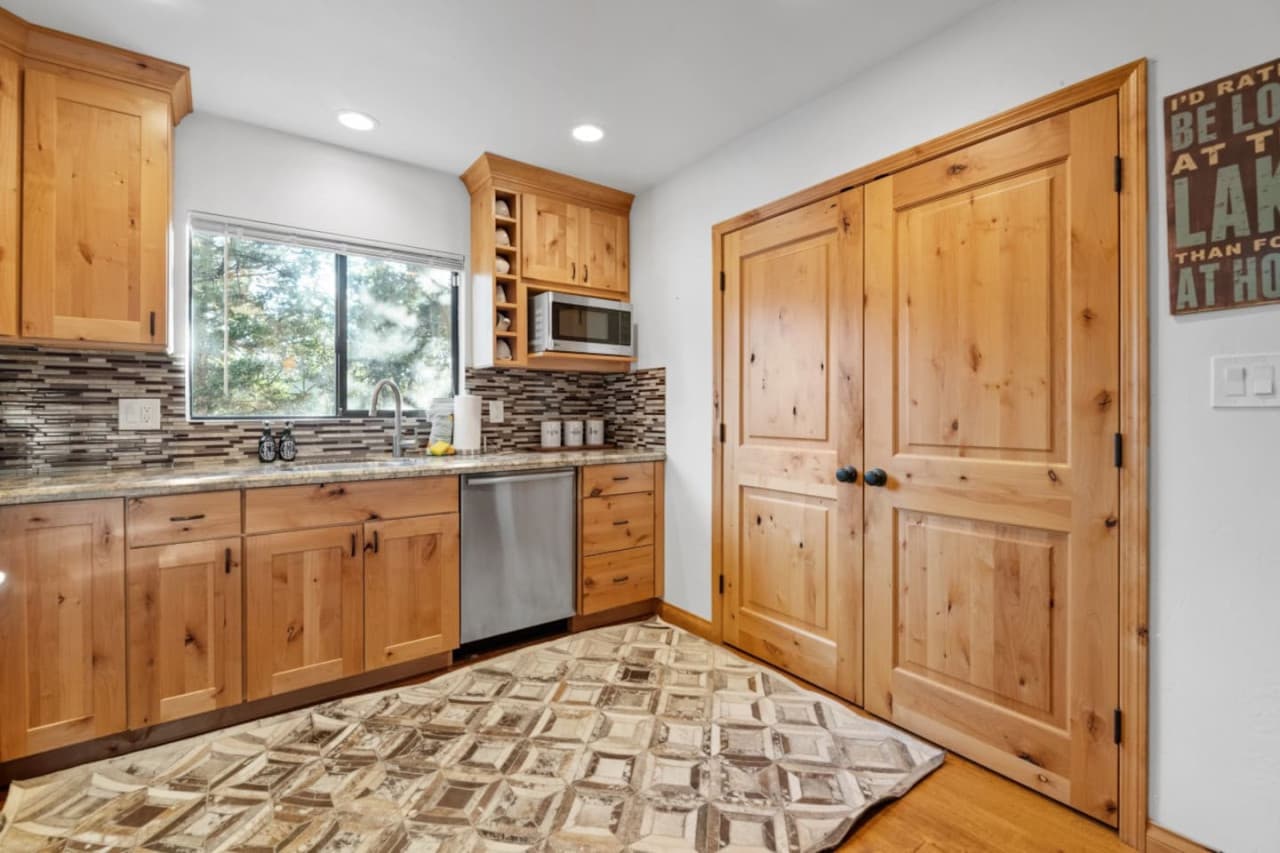 Your cooking sanctuary awaits! Experience luxury in this well-equipped kitchen adorned with inviting wood touches