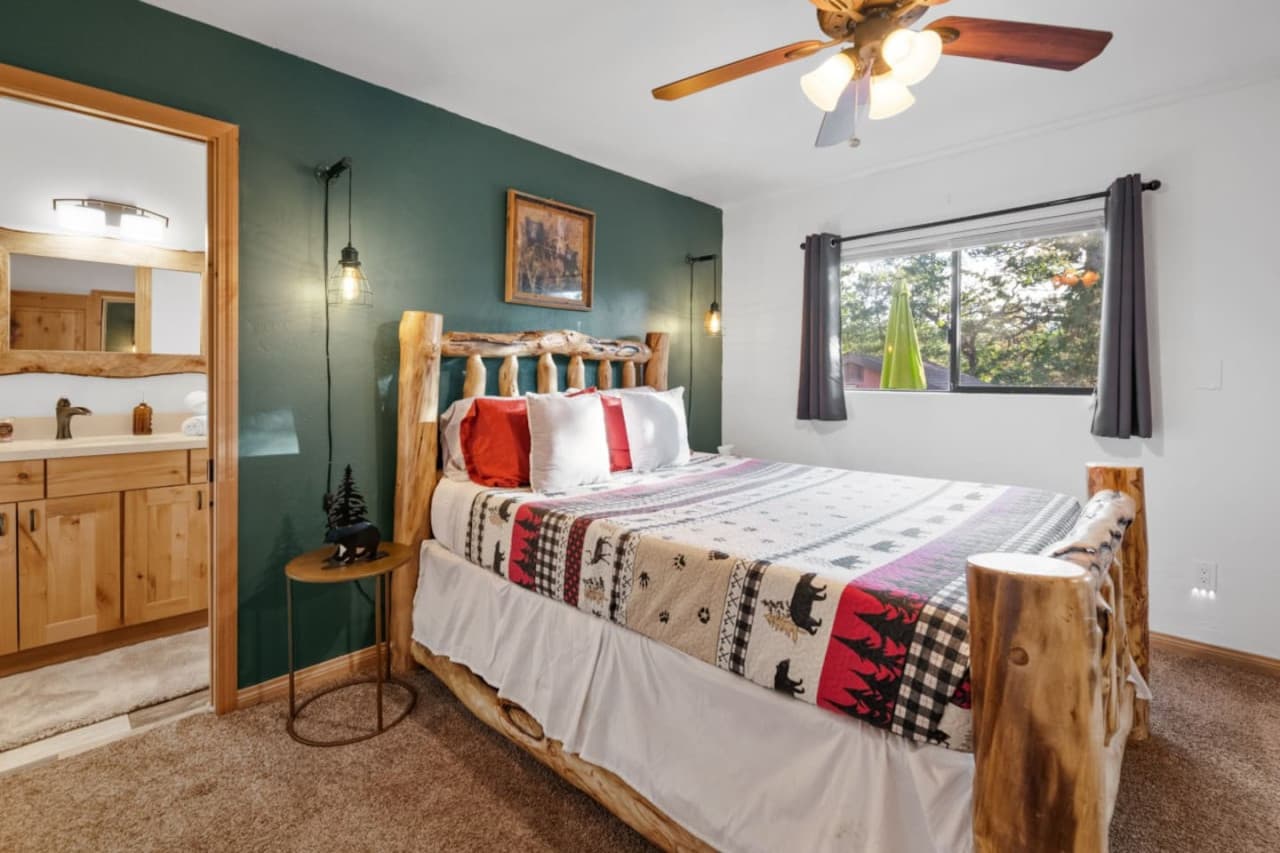 Relax in elegance in our comfortable bedroom with a double bed, ceiling fan, comfortable bedside table, and charming ornaments.