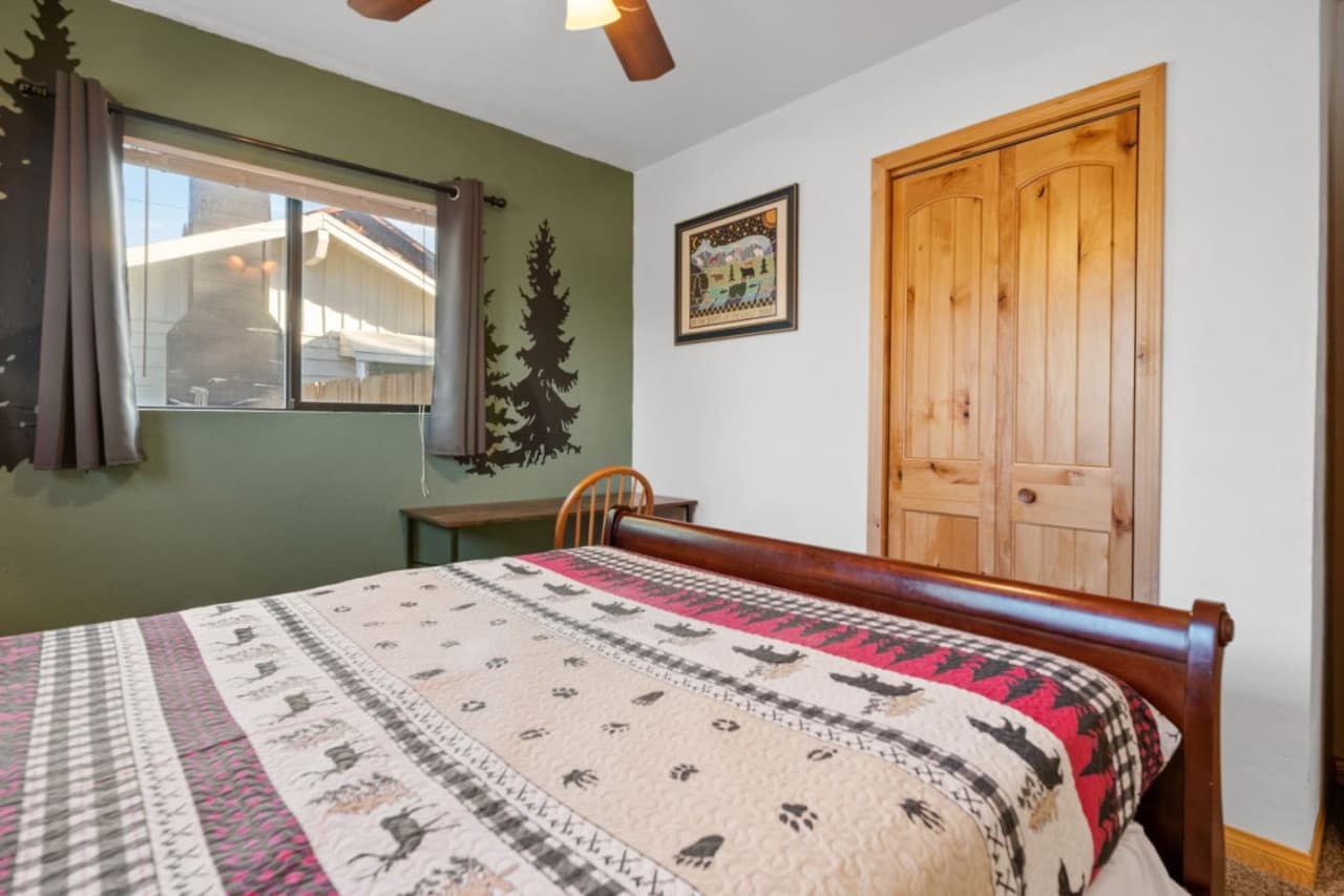 Indulge in our inviting room with a snug double bed, soothing fan, versatile desk, and appealing decor. Your personal oasis of calm