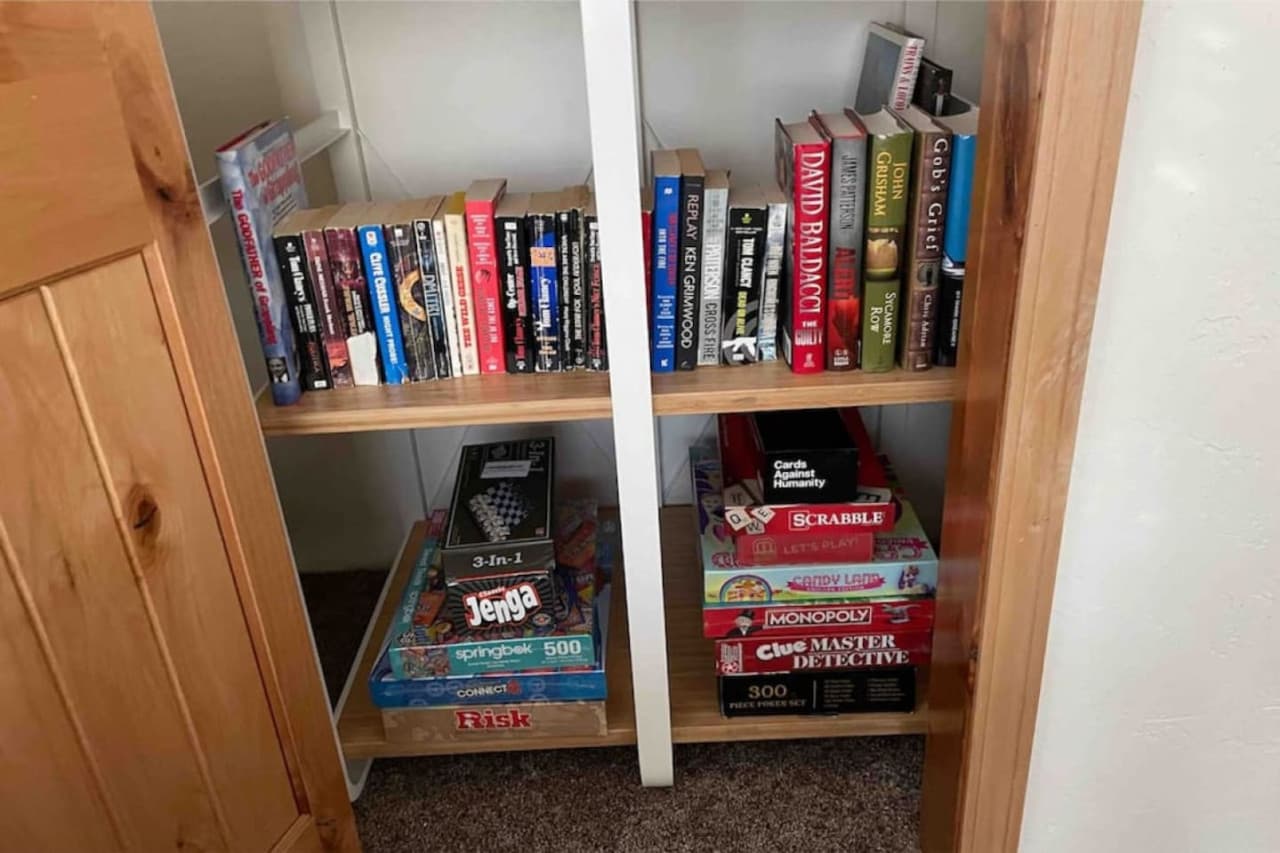A huge selection of brand new board games including Jenga, Connect 4, Risk, Cheese, Cheekers, Scrabble, Candy Land, Monopoly, Clue, Cards Against Humanity, a poker set, playing cards, puzzles and a variety of novels to choose from -Rather Be Properties