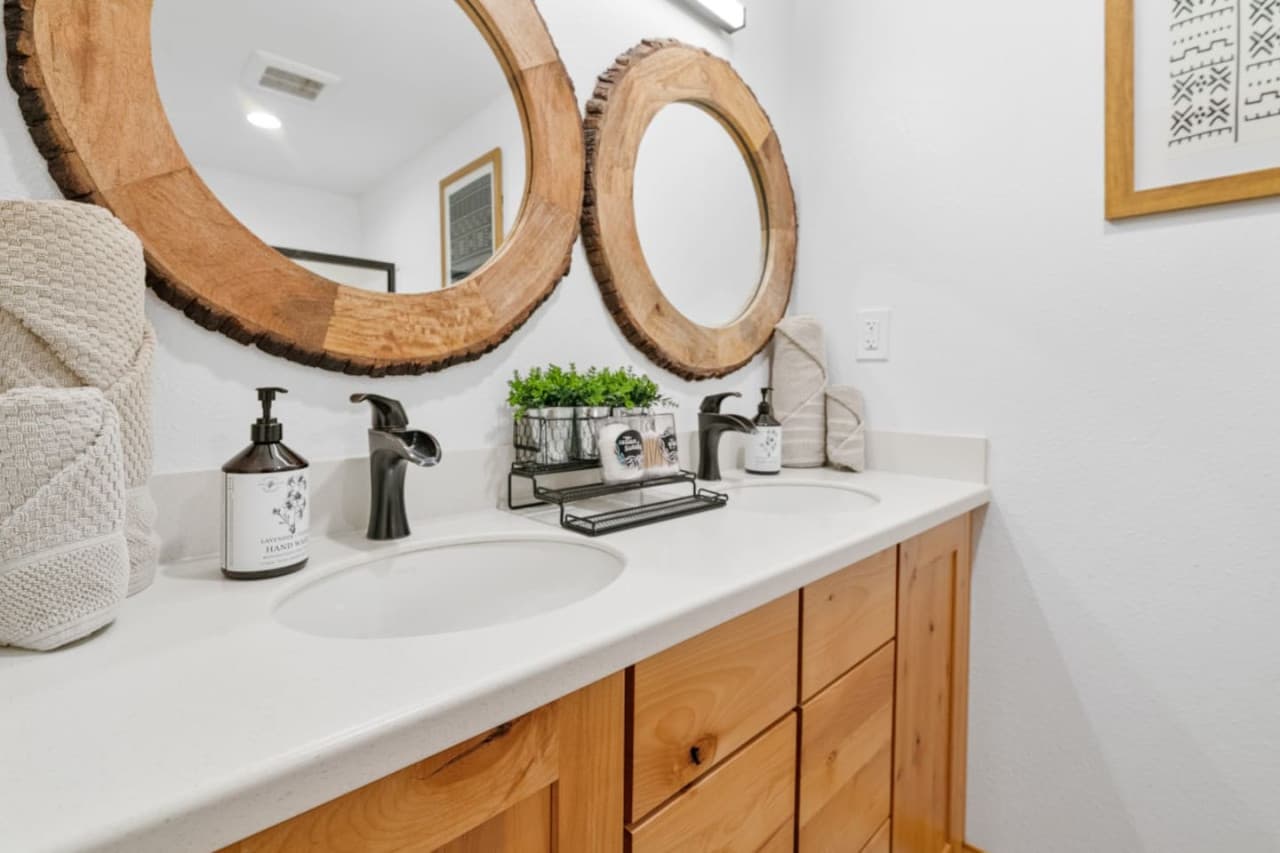 Second bathroom a bath- shower combo, equip with towels, shampoo, conditioner, body wash, hand soap, hair dryers and ample toilet paper -Rather Be Properties