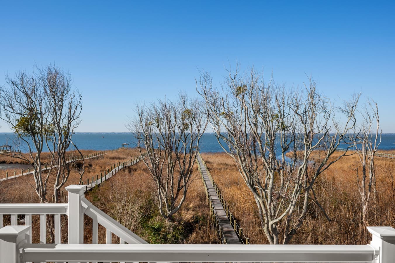 Peaceful marsh outlook w/ open sky views, perfect for quiet moments & coastal breezes