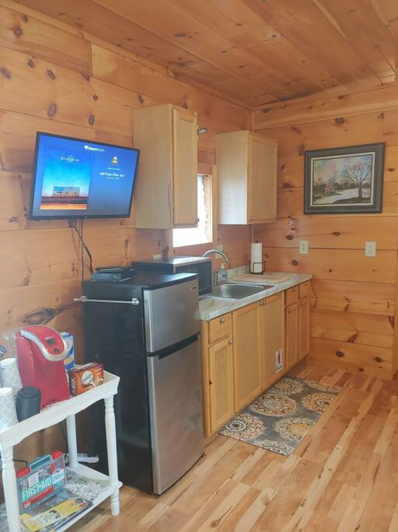TV in living room offers Roku streaming and DVD player. Free rural wifi.