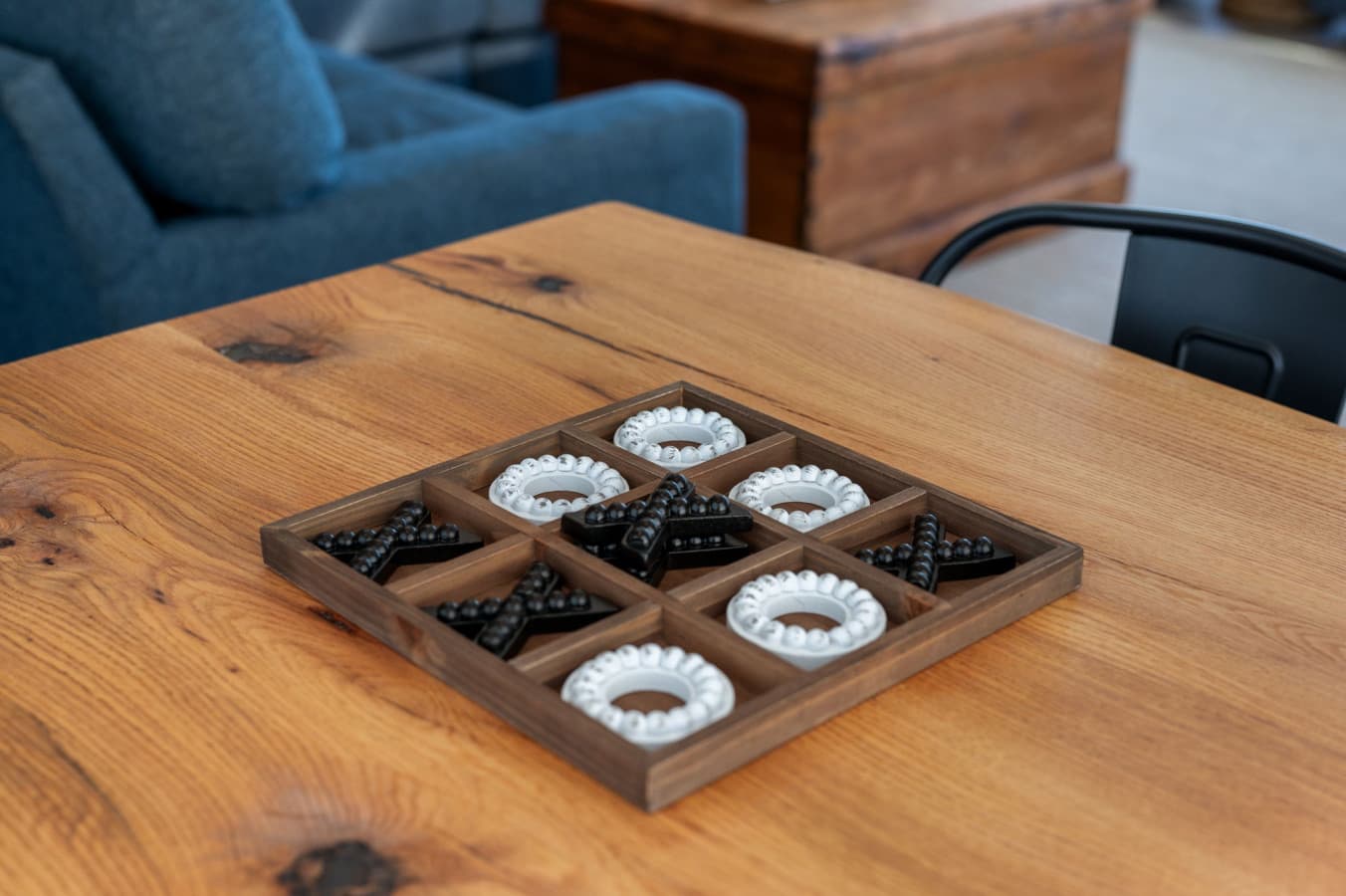 Rustic wood coffee table w/ decorative accents adding warm, coastal charm
