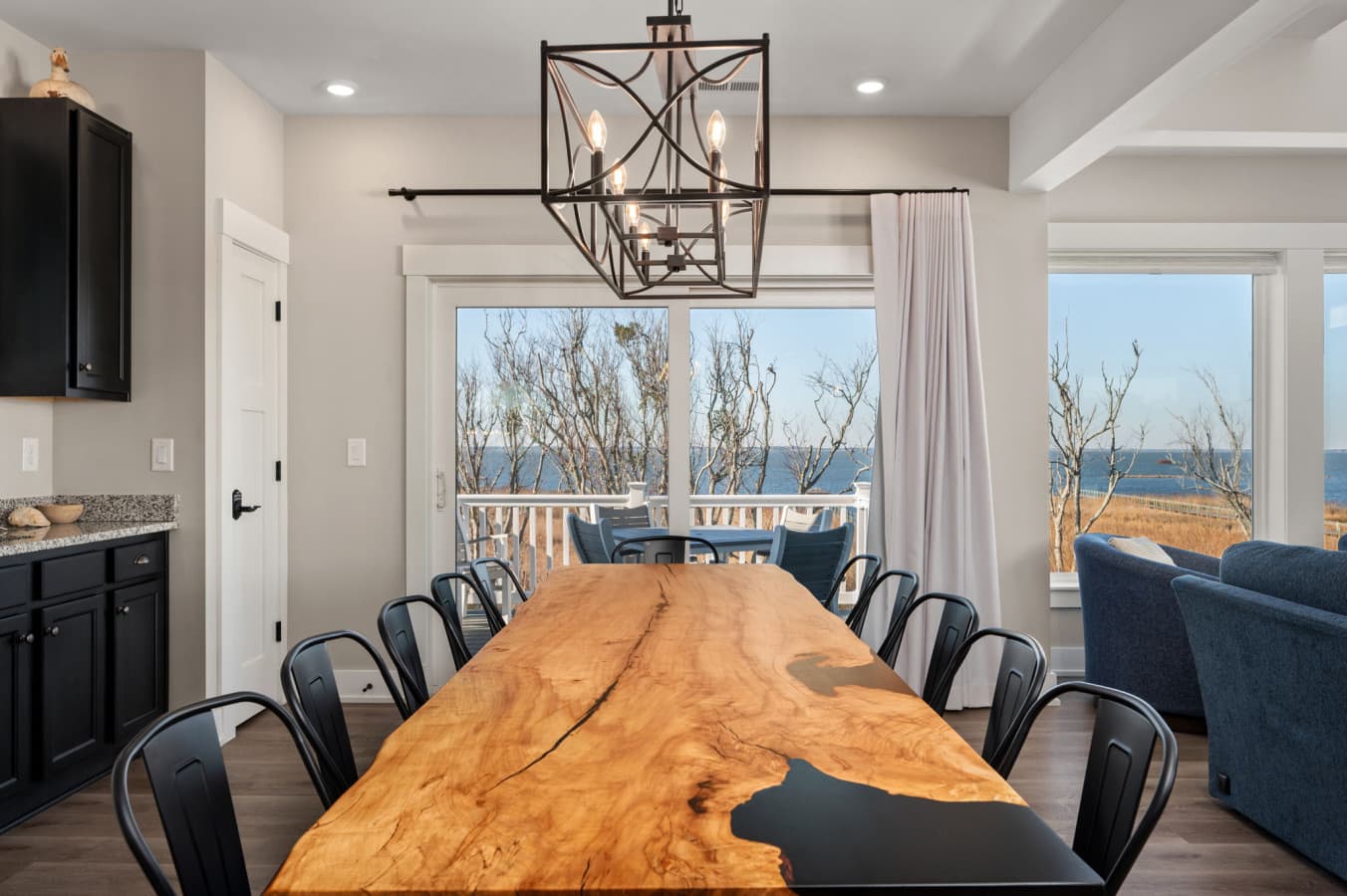 Spacious dining setup w/ comfortable seating, ideal for shared dinners & celebrations
