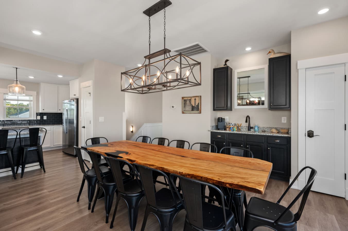Open dining-to-kitchen flow w/ generous table space & stylish finishes throughout
