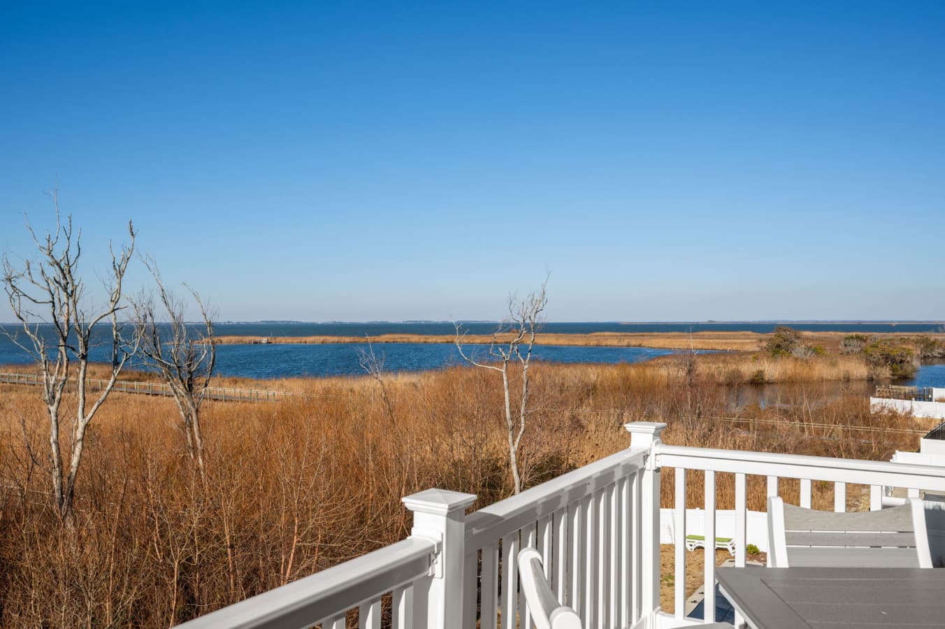 Wide-open marsh & water views stretching to the horizon from the elevated deck