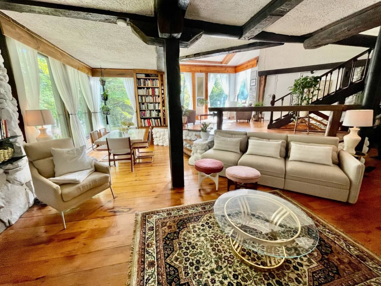 Main living/dining area with wood stove, TV.