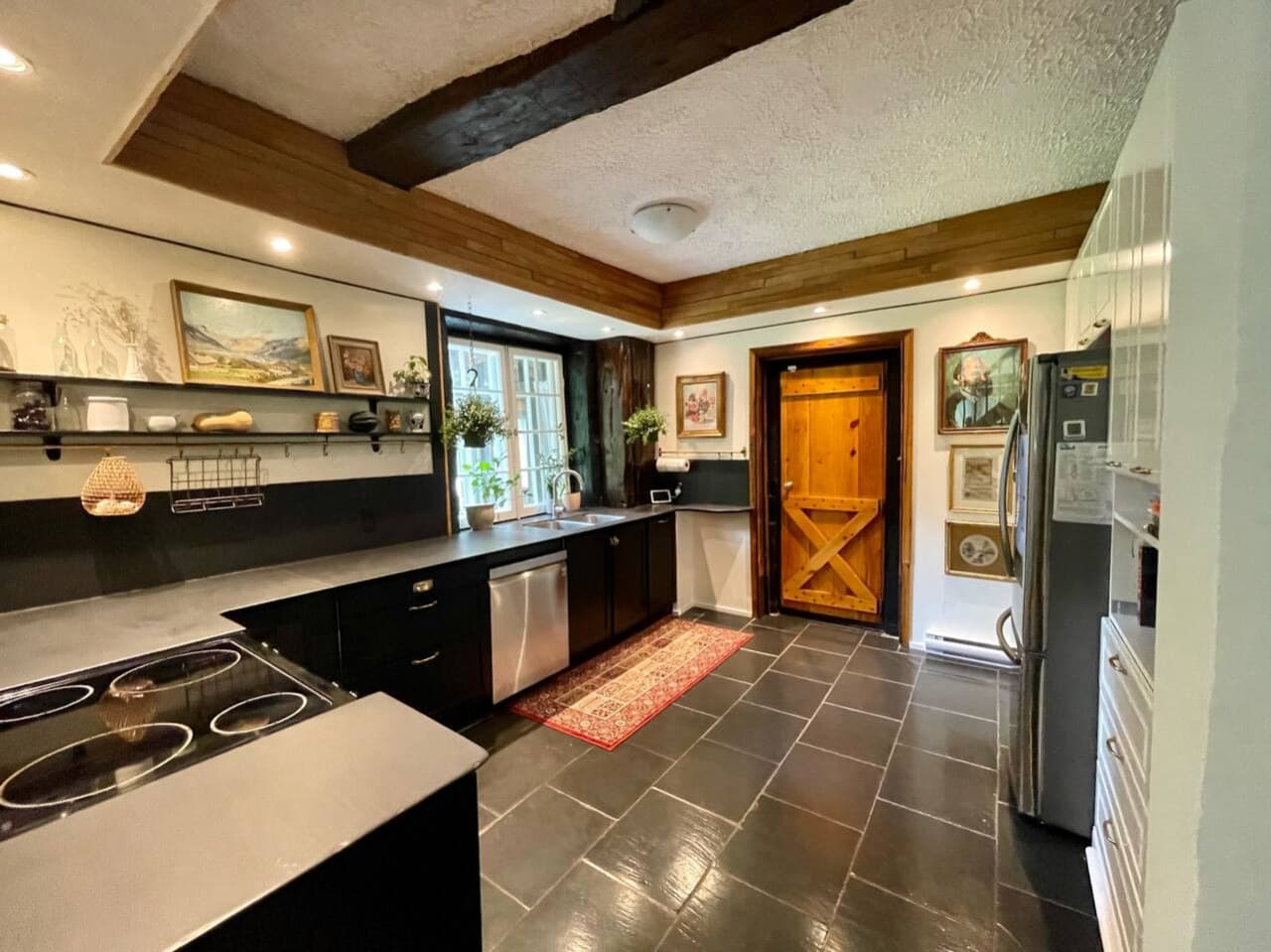 A kitchen for foodies! And those black countertops? They’re salvaged slate chalkboards from an old schoolhouse!