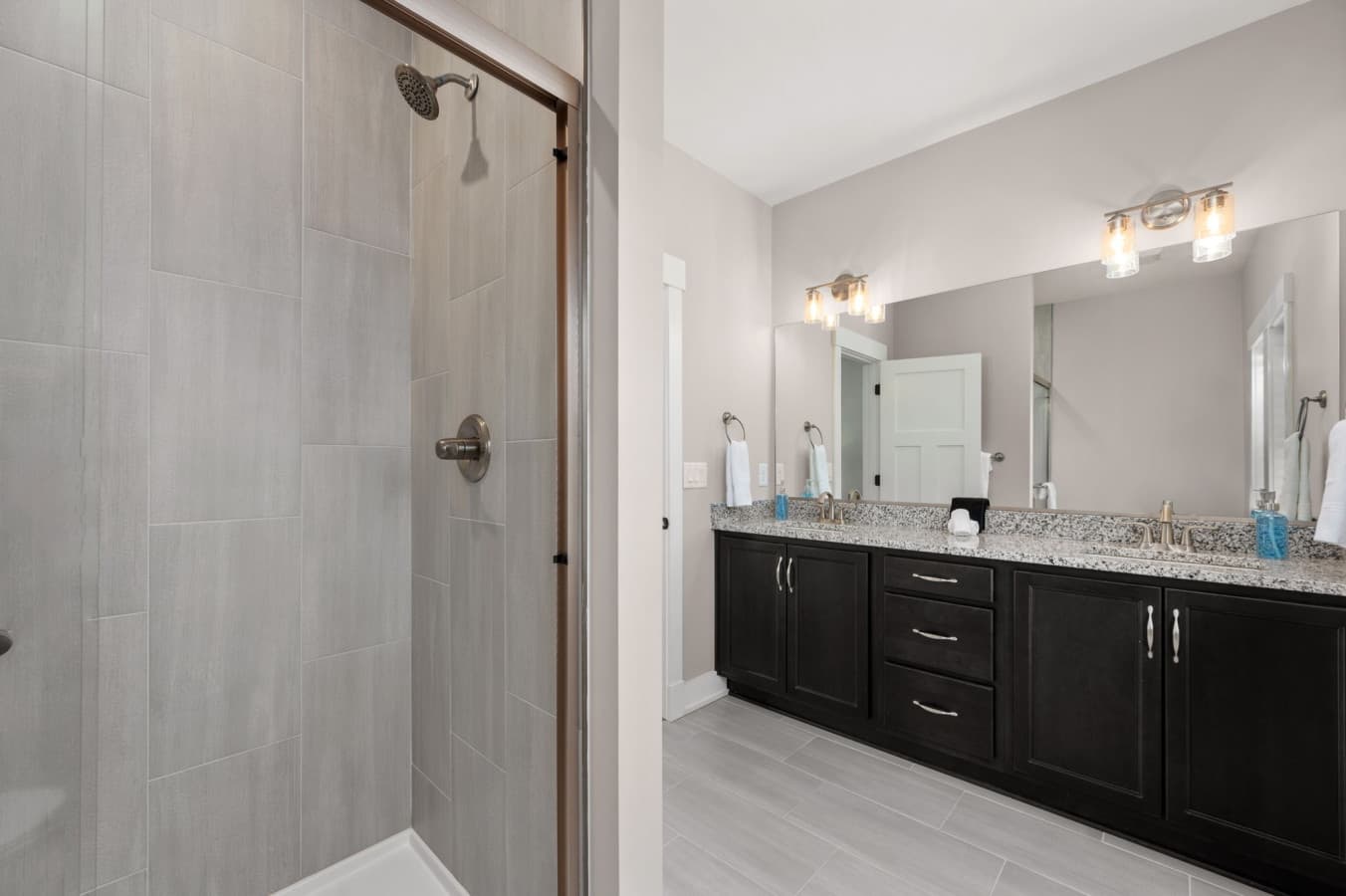 Modern bathroom w/ walk-in shower & sleek vanity design