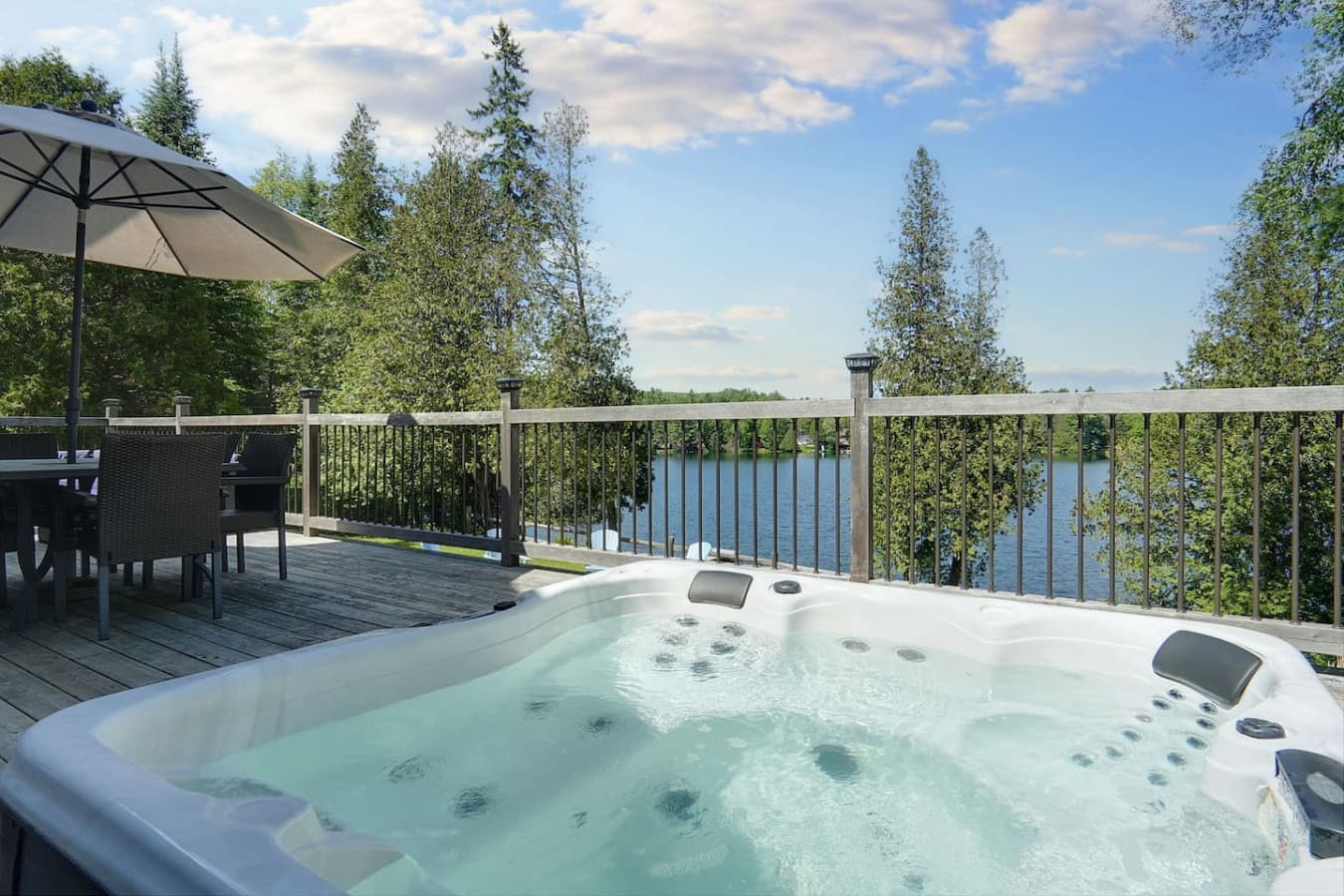 hot tub overlooking the lake on large deck