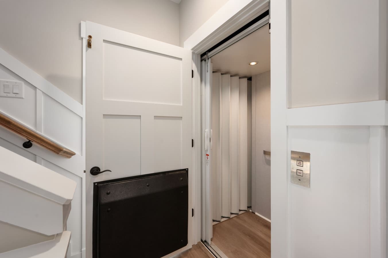 Neat hallway nook w/ storage & stair access keeping things organized