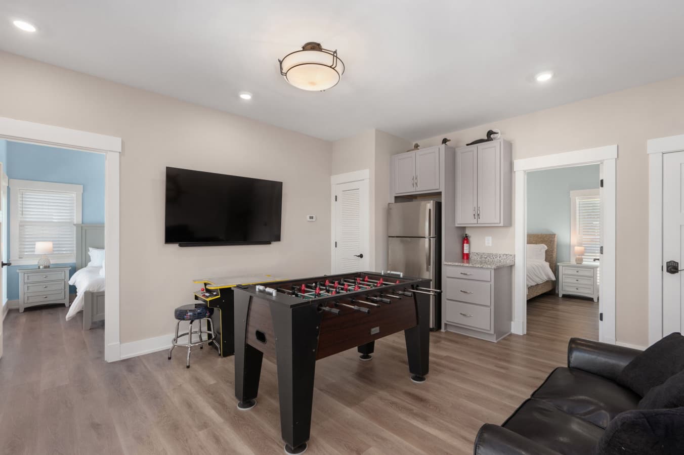 Game level w/ wall TV, foosball & a full-size fridge just steps from the bedrooms