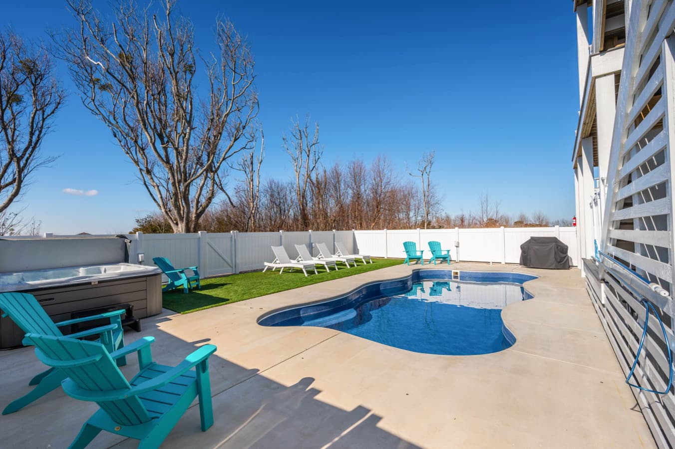 Pool & hot tub side by side w/ Adirondack chairs & loungers for sunny afternoons