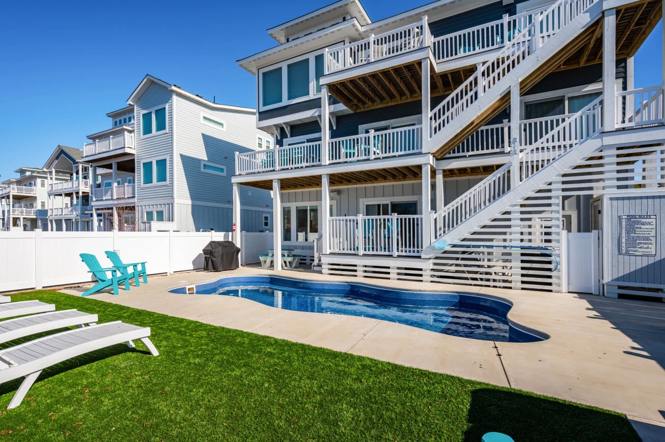 Rear exterior w/ multi-level decks, private pool & hot tub for group gatherings outside