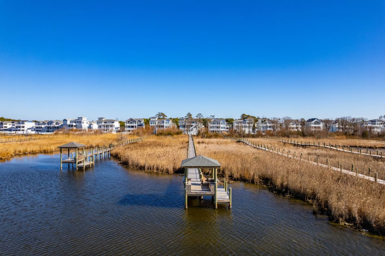 Aerial of the private dock & boardwalk winding through the marsh to the sound