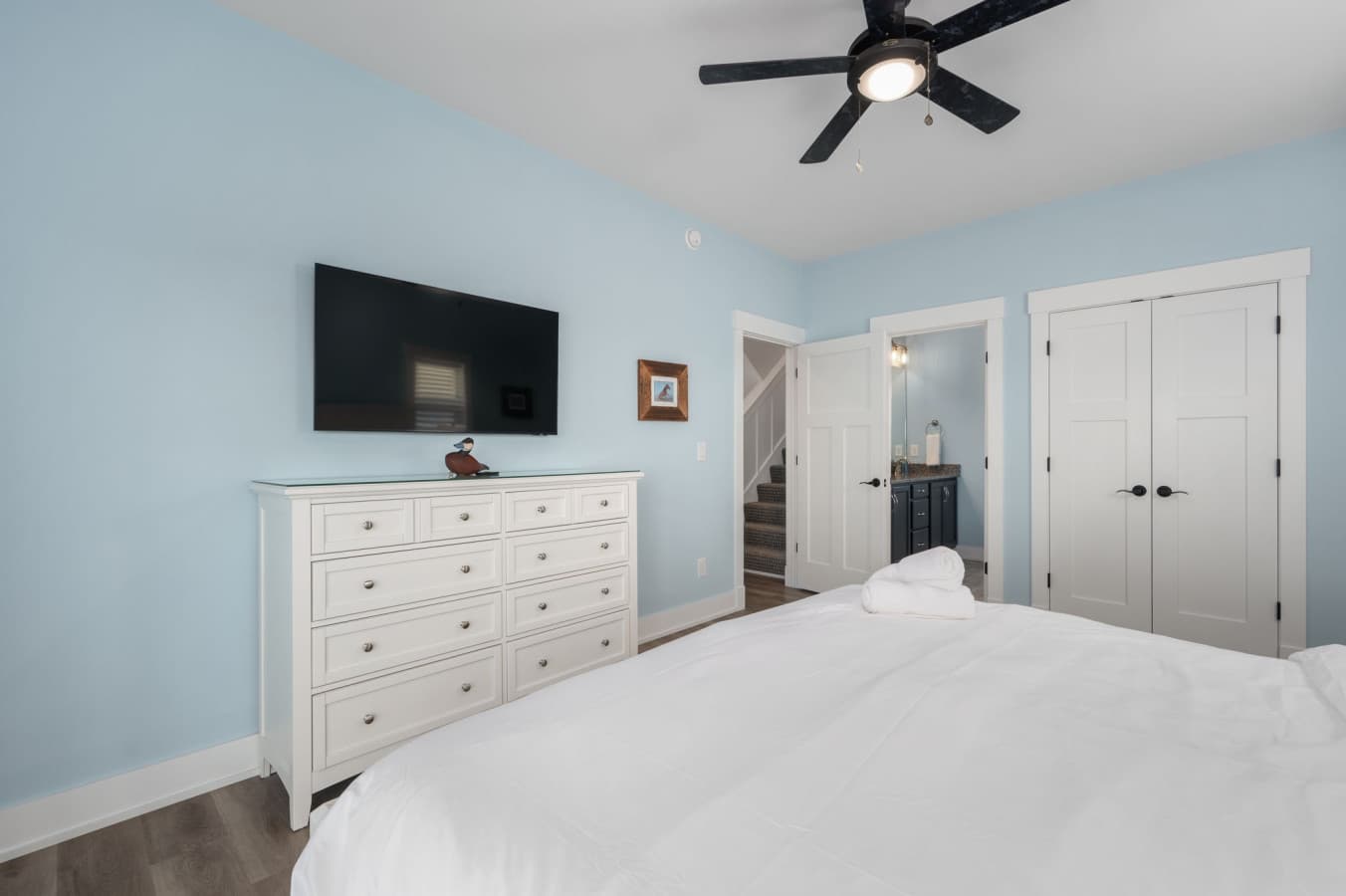 Bedroom w/ king bed, dresser-top TV & double closet for longer stays
