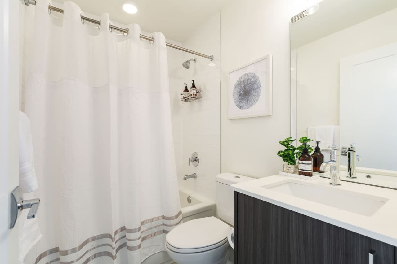 Indulge in luxury in the full bathroom, complete with a bathtub, shower, and complimentary shampoo, conditioner, and soap. Soft towels are also provided for your comfort
