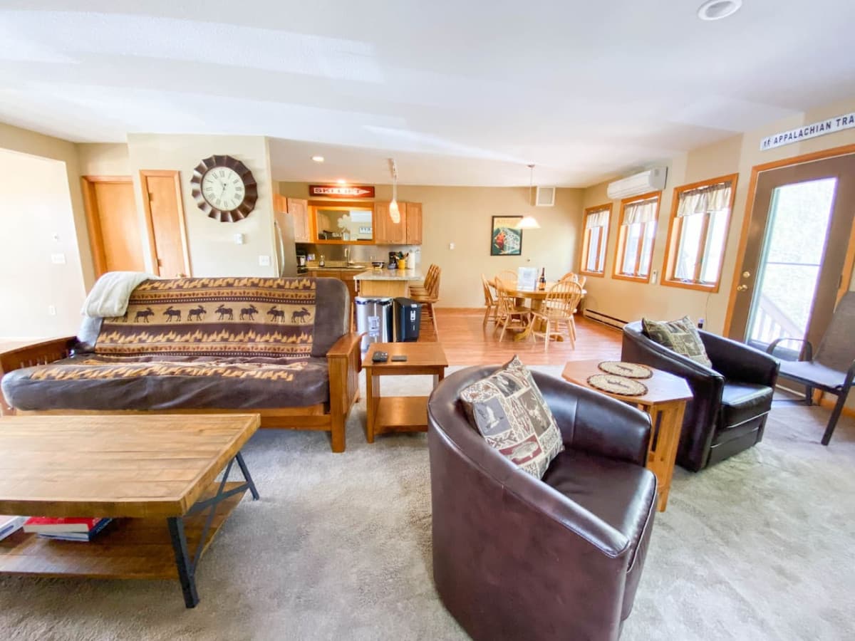spacious open concept living room with kitchen
