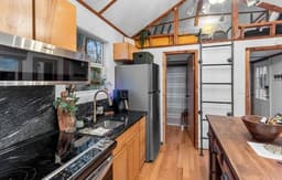 Lakefront Tiny Emerald w/kayaks & canoes