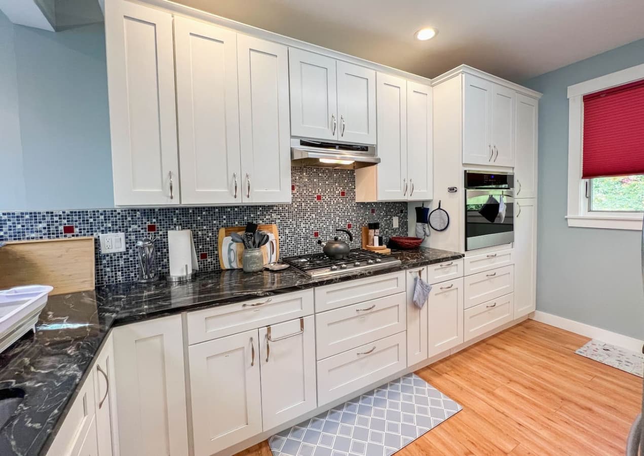 Fully stocked kitchen has everything you need for a relaxing dinner at home, including crock pot and popcorn popper.